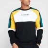 Kaotiko UNISEX - Sweatshirt - Black/white/yellow -Kaotiko || Fire And Glory Populaire Magasin 5efba3b007984c0eb88169888f711247